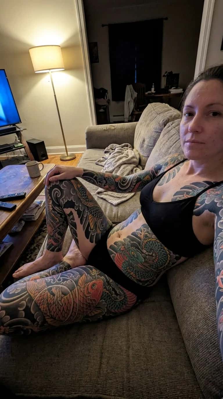 Japanese (Irezumi) tattoo idea on a woman — couch candid