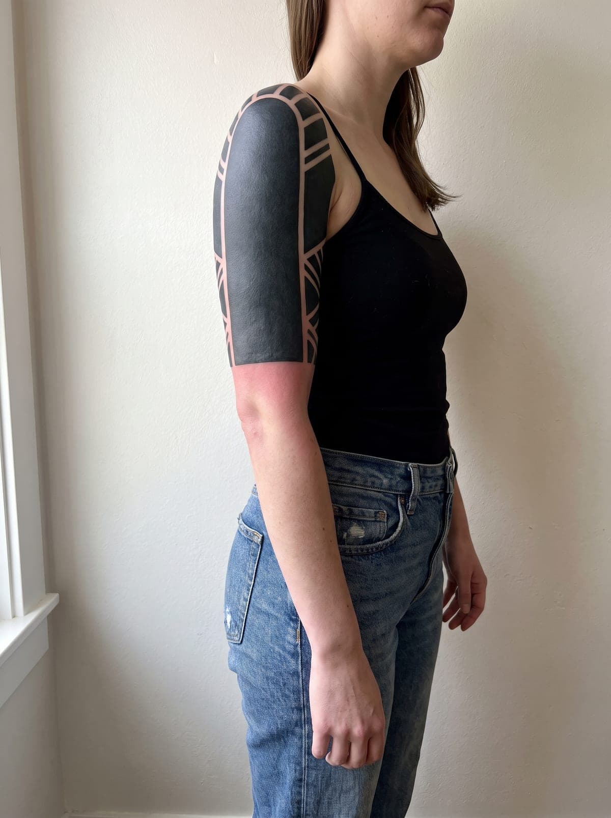 Blackout half sleeve tattoo — half-sleeve covering shoulder to elbow