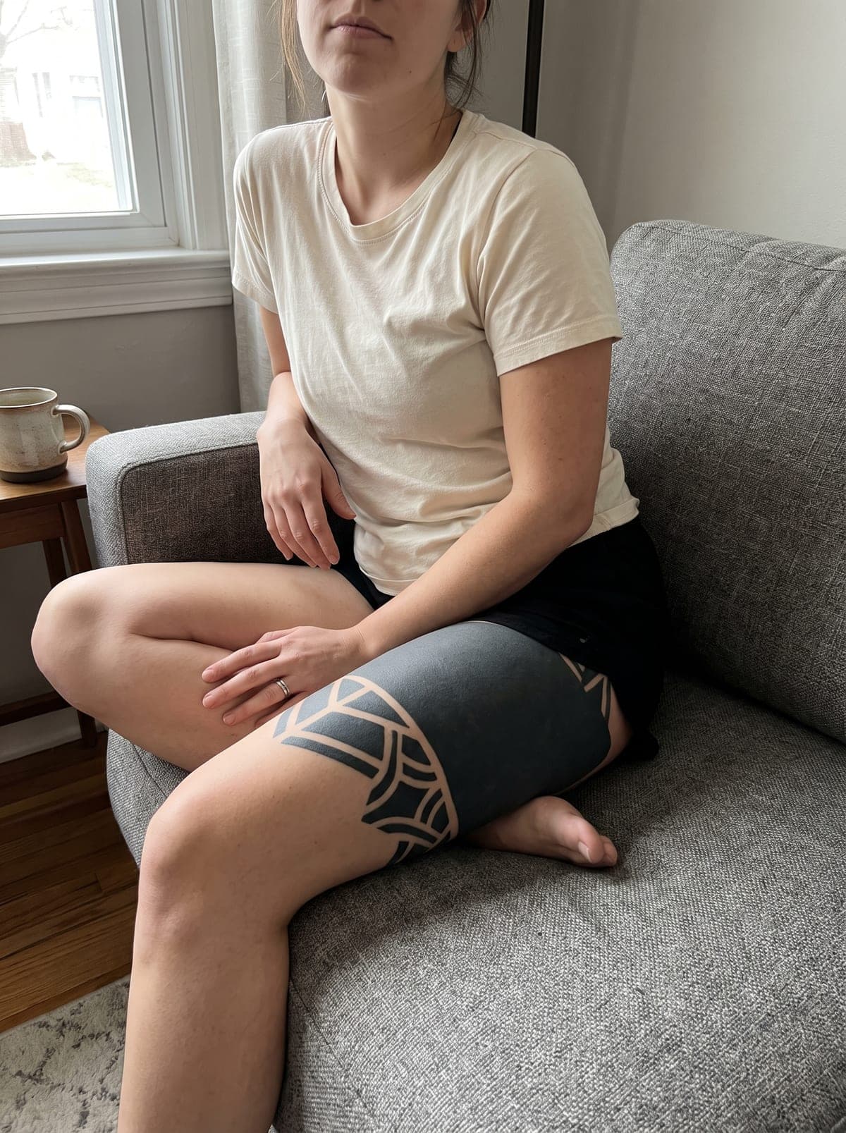 Blackout thigh tattoo — thigh piece from hip to above the knee