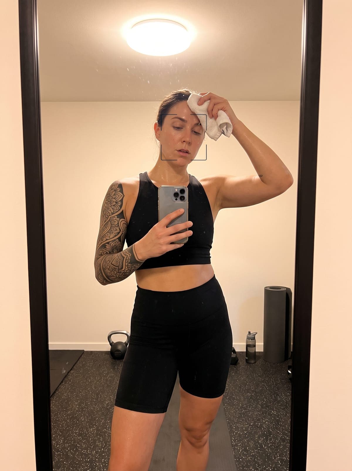 Blackwork 3/4 sleeve tattoo — three-quarter sleeve covering shoulder to mid-forearm