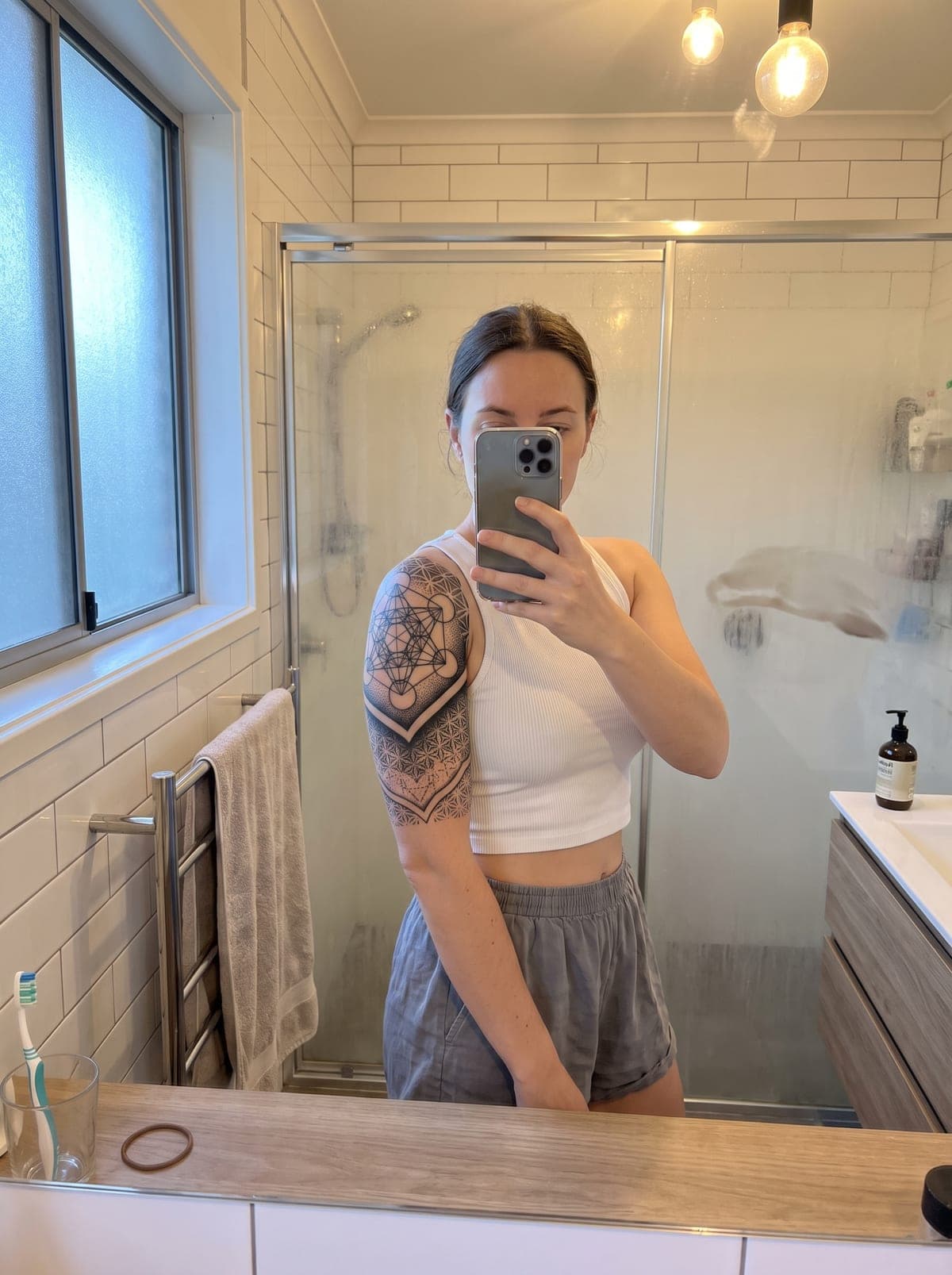Geometric half sleeve tattoo — half-sleeve covering shoulder to elbow